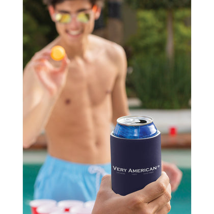 Young man playing beer pong with a Very American® Drink Cooler in the photo.