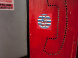 Logo sticker on a phone booth.